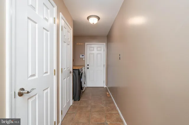 a view of a hallway with a white door