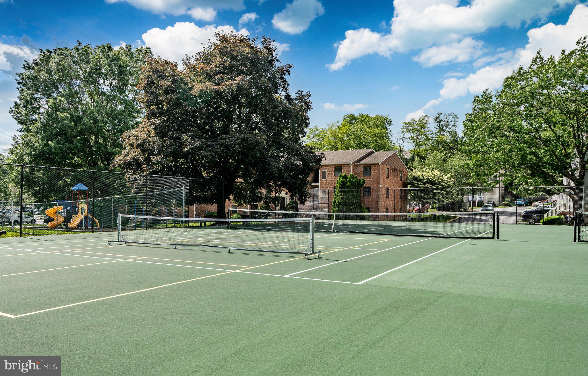 2905 Eagle Road West Chester, PA 19382 - Photo 19 of 19 Sunny tennis courts in a vibrant park.