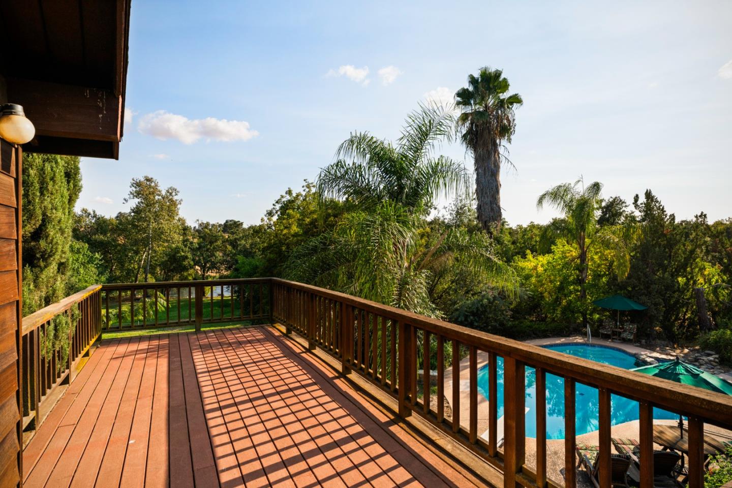 7555 Merced Falls Road Snelling, CA 95369 - Photo 12 of 77 a view of balcony with wooden floor and fence