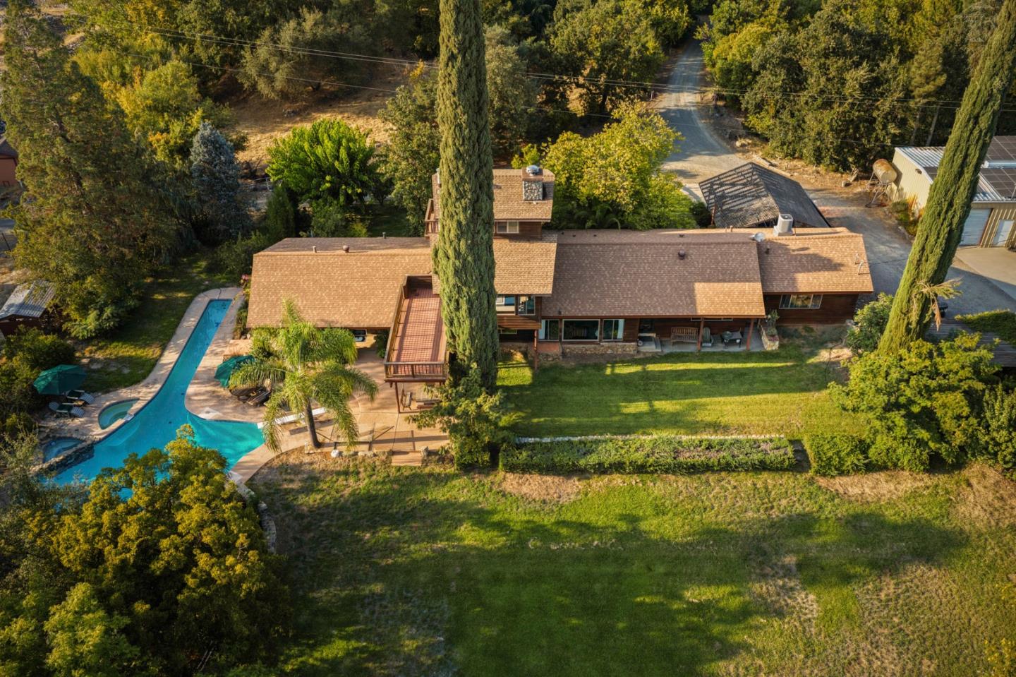 7555 Merced Falls Road Snelling, CA 95369 - Photo 27 of 77 an aerial view of a house with a garden and trees
