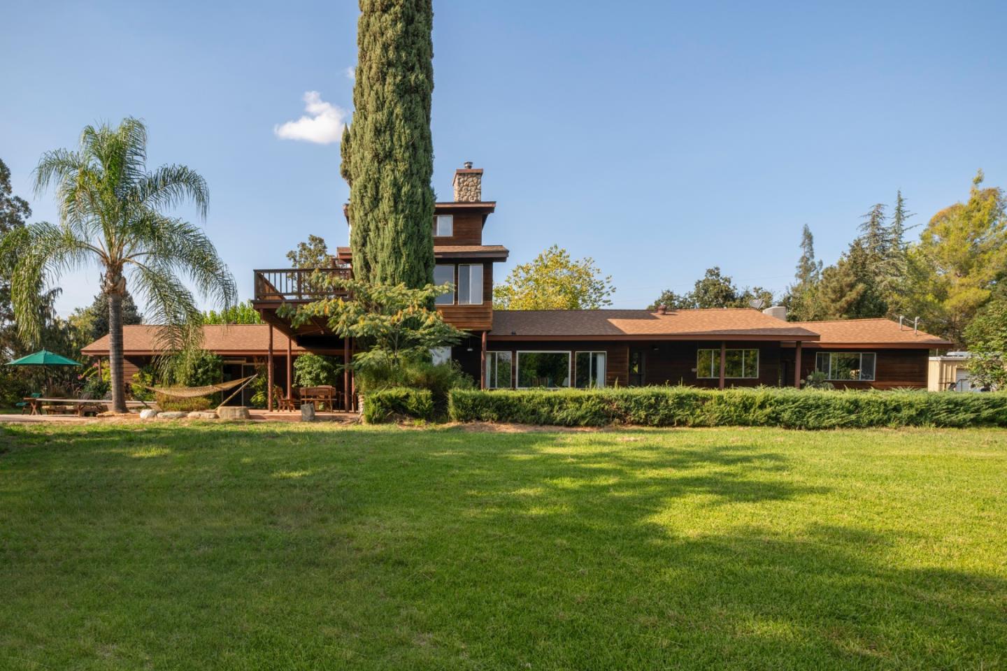 7555 Merced Falls Road Snelling, CA 95369 - Photo 4 of 77 a front view of a house with a garden