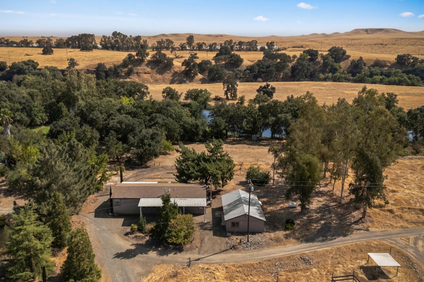 7555 Merced Falls Road Snelling, CA 95369 - Photo 42 of 77 an aerial view of a house with a yard and lake view