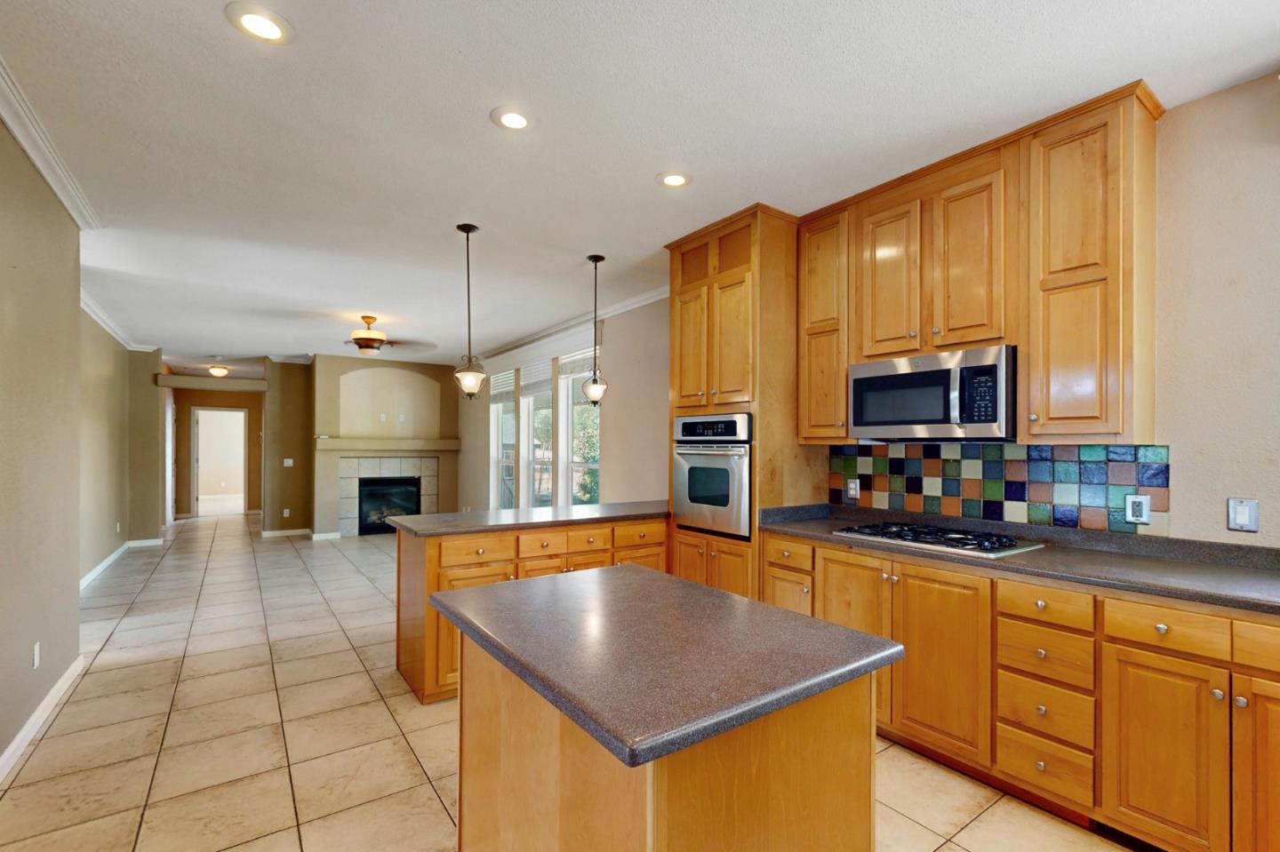 7555 Merced Falls Road Snelling, CA 95369 - Photo 45 of 77 a kitchen with stainless steel appliances a sink counter space cabinets and a couch