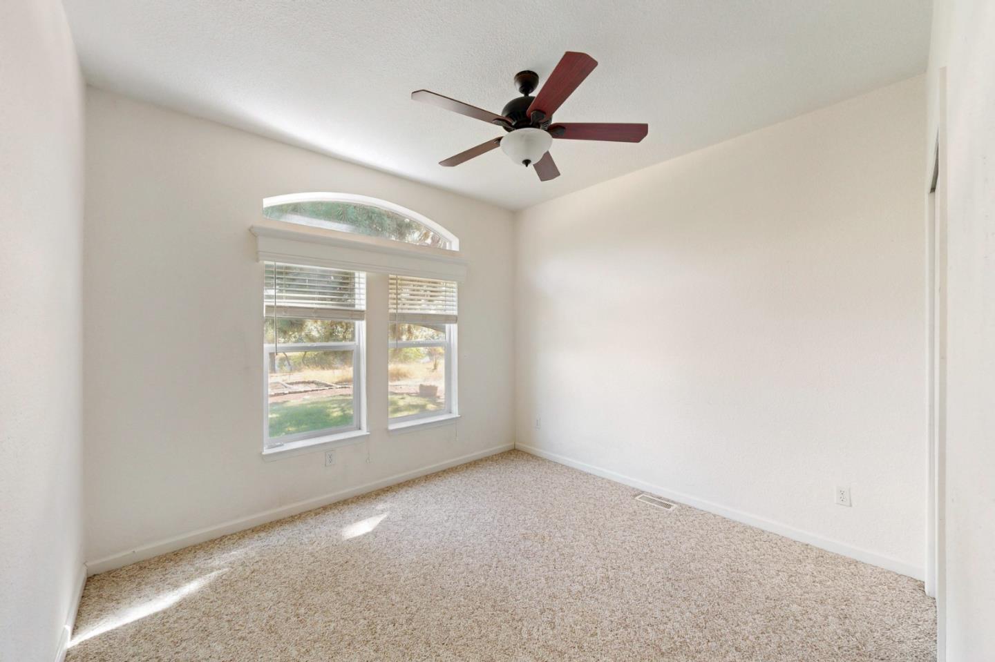 7555 Merced Falls Road Snelling, CA 95369 - Photo 57 of 77 an empty room with windows and fan