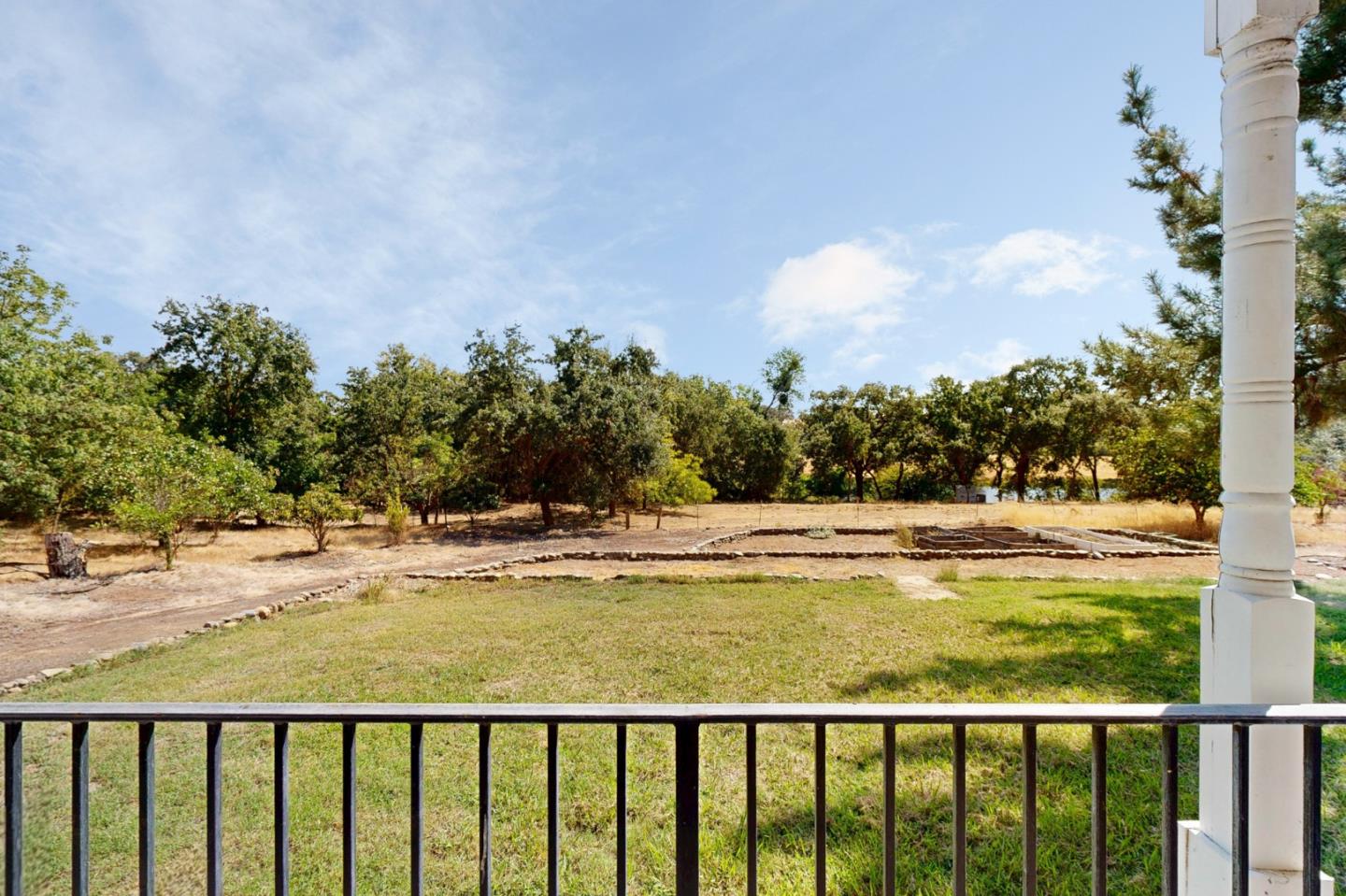 7555 Merced Falls Road Snelling, CA 95369 - Photo 59 of 77 a view of a swimming pool and trees in the background