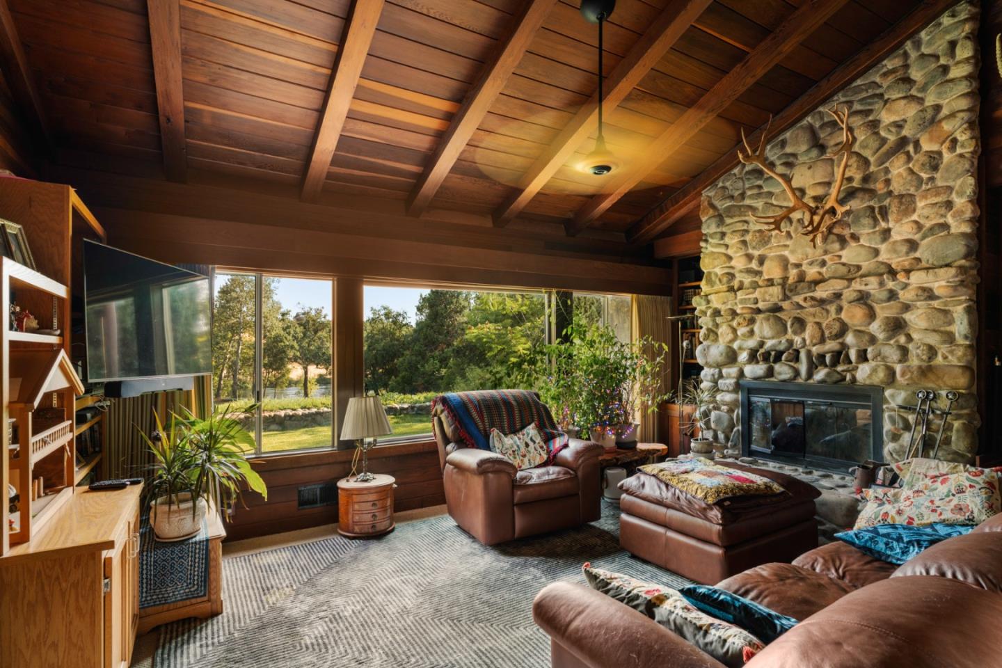 7555 Merced Falls Road Snelling, CA 95369 - Photo 6 of 77 a living room with furniture and a fireplace