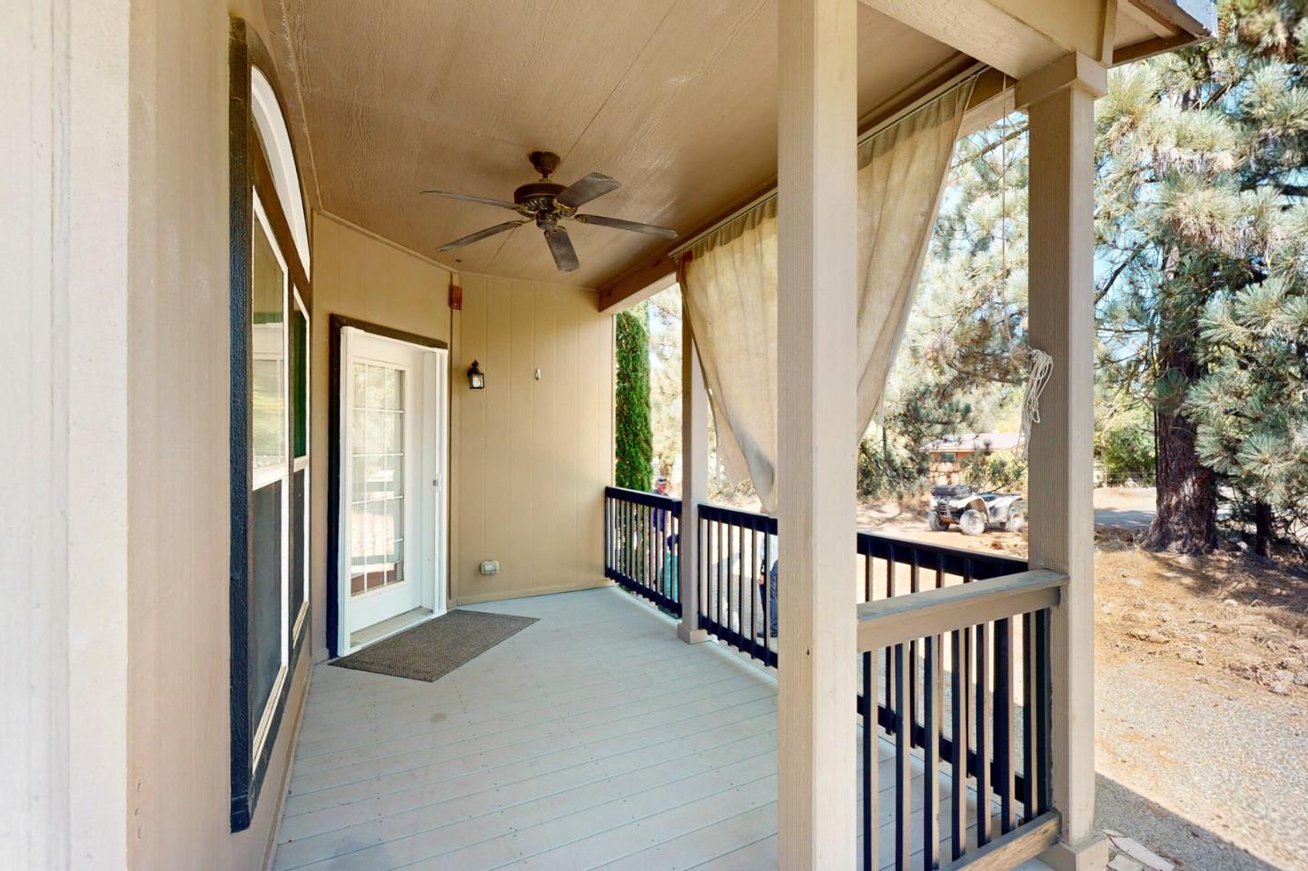 7555 Merced Falls Road Snelling, CA 95369 - Photo 61 of 77 a view of a porch with wooden floor and windows
