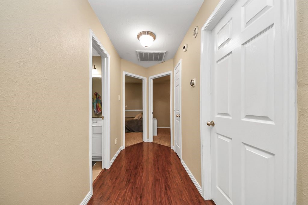 137 Rustic Colony Lane Dickinson, TX 77539 - Photo 7 of 13 Hall to additional beds and bath
