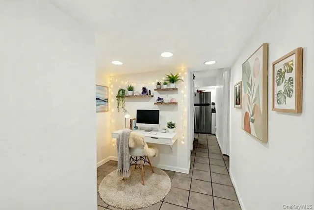 a view of a kitchen with dining area a sink and a refrigerator