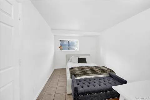 a kitchen with a stove and white cabinets