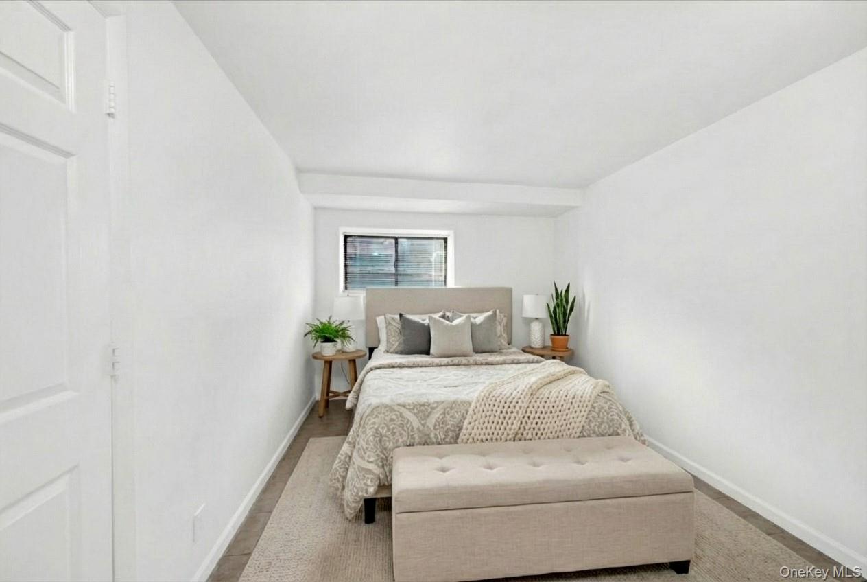 1456 Boston Post Road, Unit K2 Larchmont, NY 10538 - Photo 22 of 27 a bedroom with a bed and window