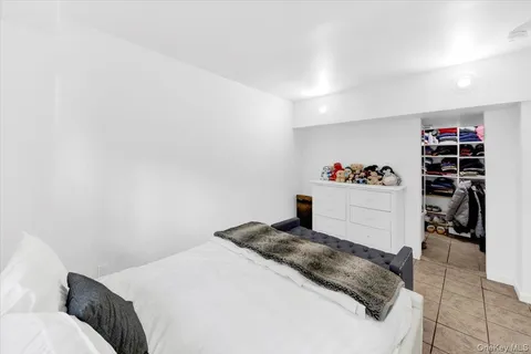 a bedroom with a bed and closet