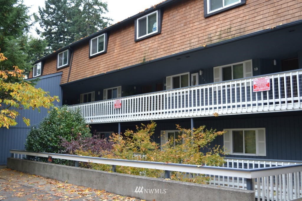15801 4th Avenue South Burien, WA 98148 - Photo 1 of 2 a front view of a house with a garden