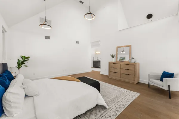 a bedroom with a bed and a closet