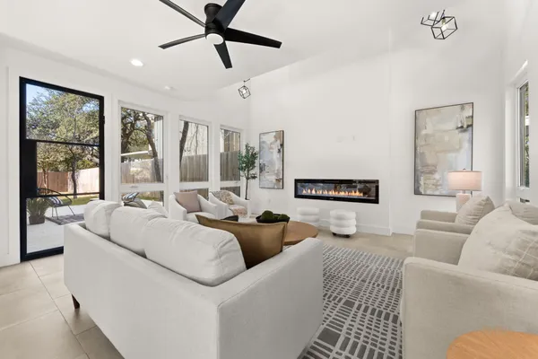 a living room with furniture and a large window