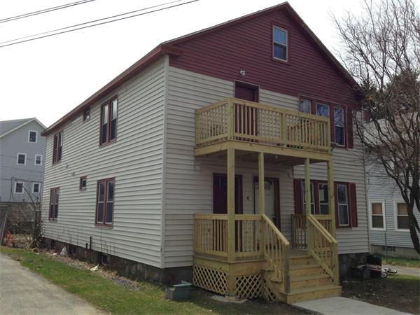 4 Assumption Avenue Worcester, MA 01606 - Photo 1 of 13 a front view of a house with a yard