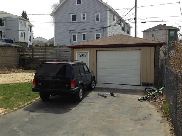 4 Assumption Avenue Worcester, MA 01606 - Photo 4 of 13 a car parked in front of a house