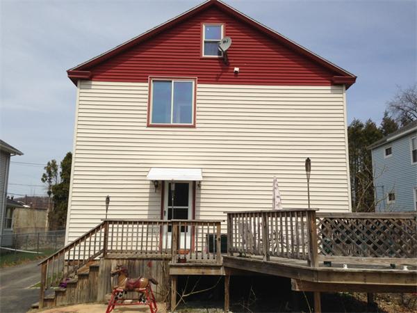 4 Assumption Avenue Worcester, MA 01606 - Photo 5 of 13 a view of a house with wooden deck