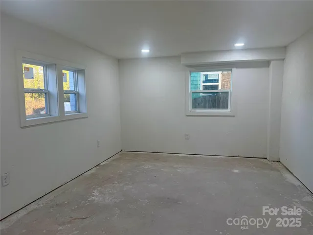 an empty room with windows