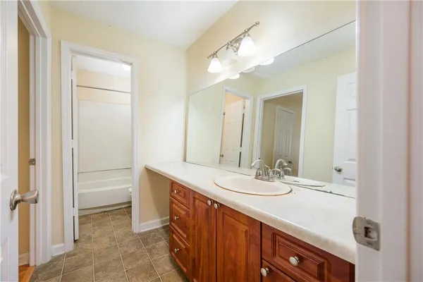 a bathroom with a sink a vanity and a mirror