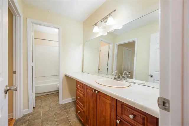 a bathroom with a sink a vanity and a mirror
