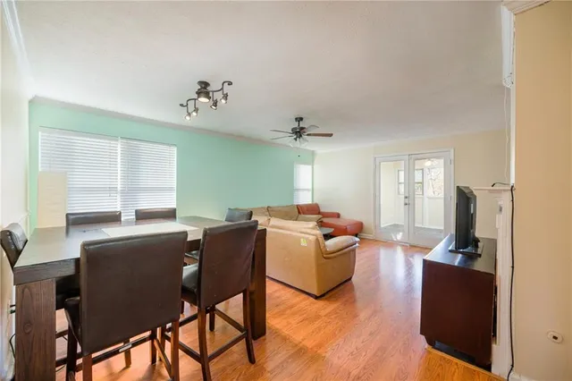 a living room with furniture dining table and a window