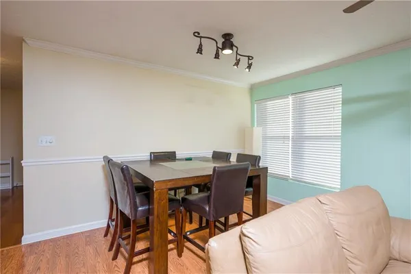 a view of a dining room with furniture and window