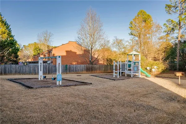 a view of a park with swings