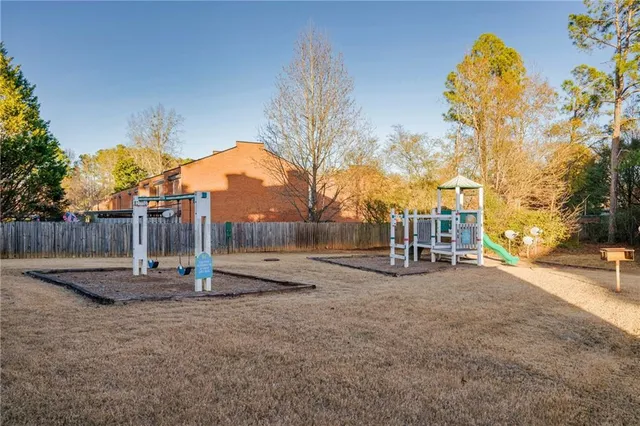 a view of a park with swings