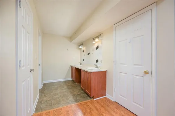 a view of a hallway with bathroom