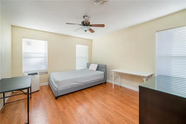 a bedroom with a bed and window