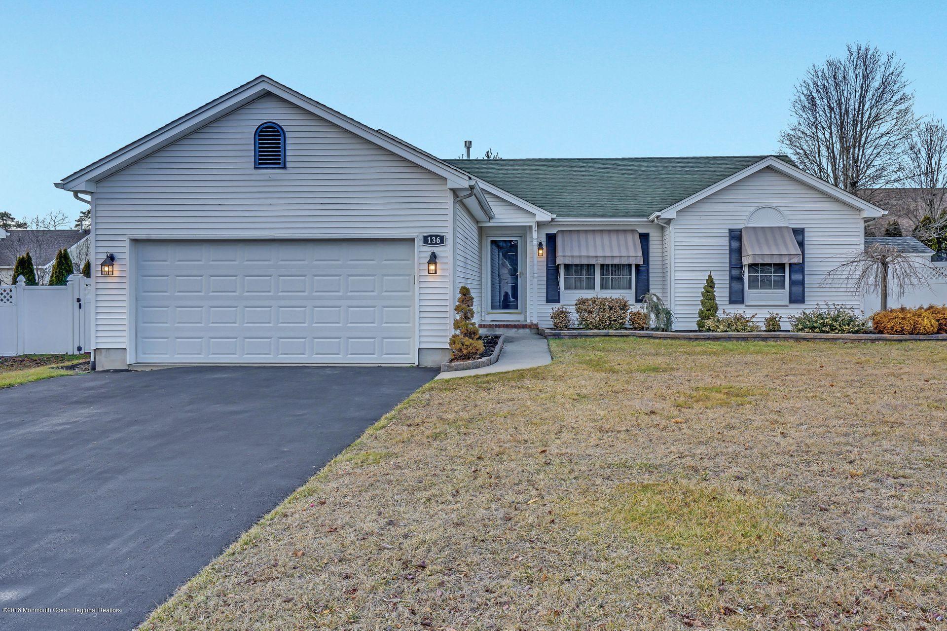 136 Cruise Road Manahawkin, NJ 08050 - Photo 1 of 34 a front view of a house with a yard