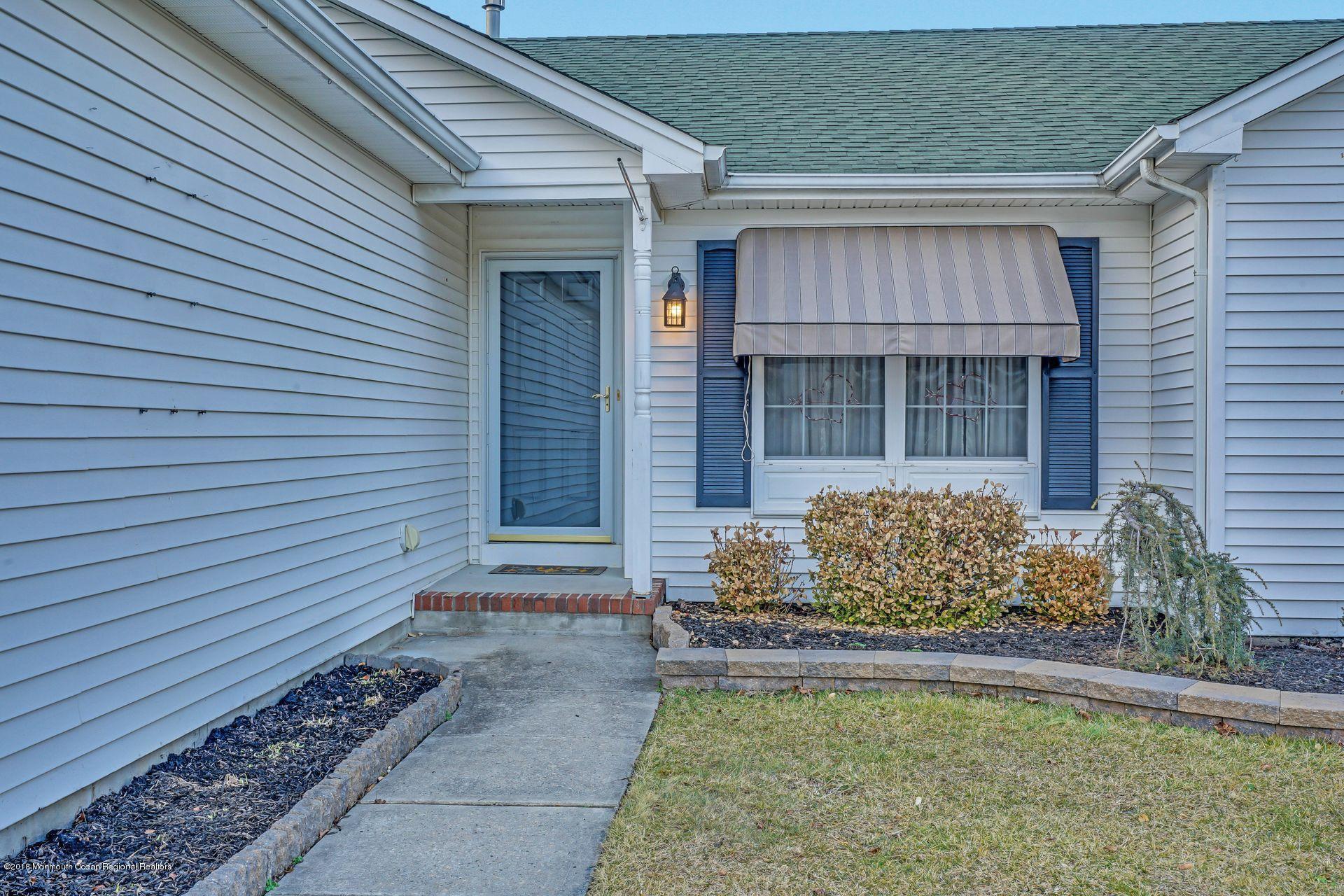 136 Cruise Road Manahawkin, NJ 08050 - Photo 2 of 34 a front view of a house with garden
