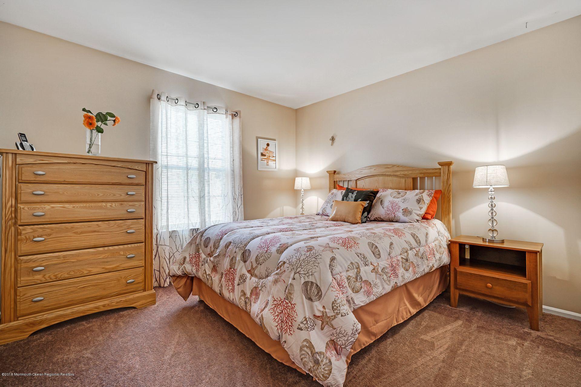 136 Cruise Road Manahawkin, NJ 08050 - Photo 24 of 34 a bedroom with a bed and a dresser