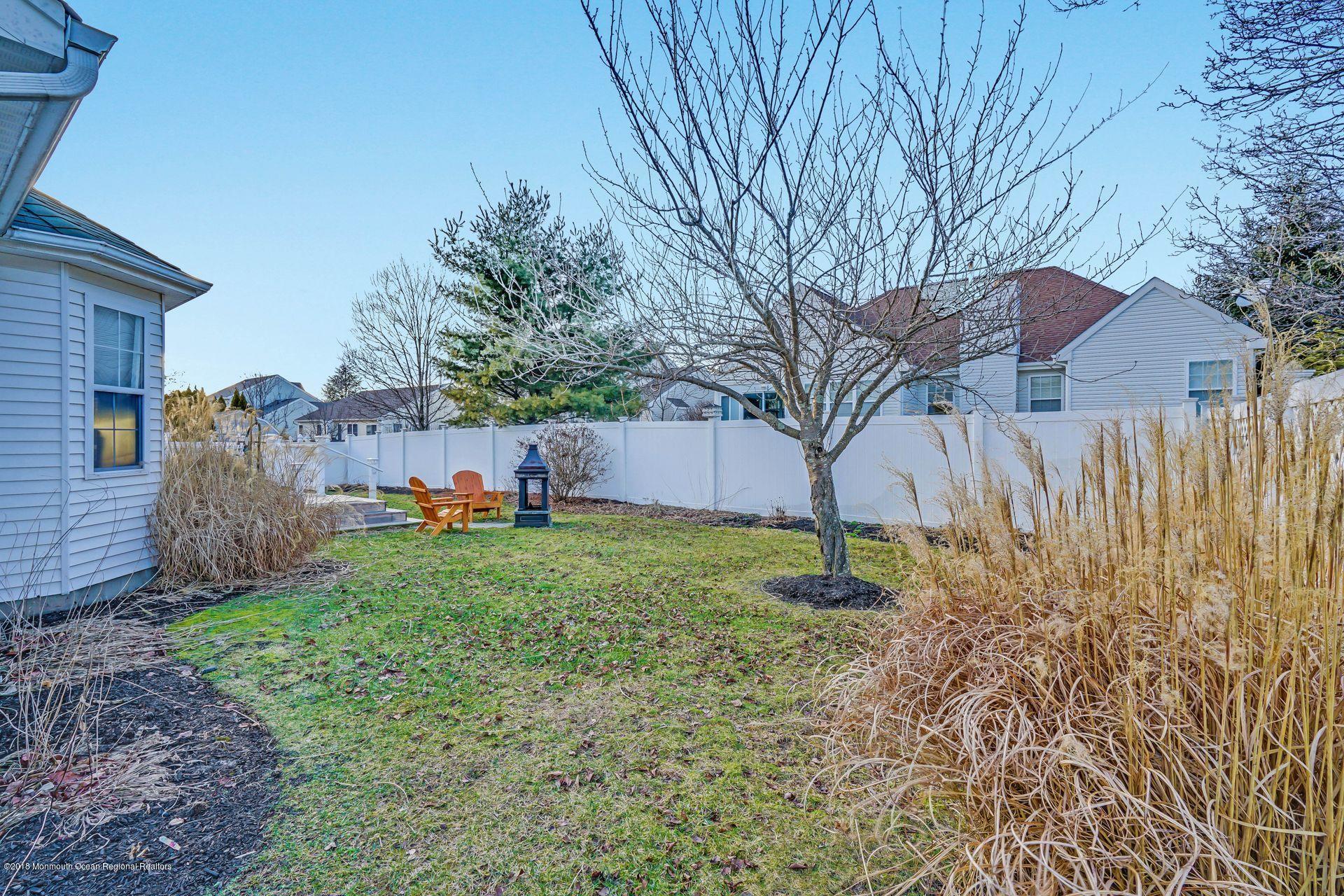 136 Cruise Road Manahawkin, NJ 08050 - Photo 30 of 34 a backyard of a house with lots of green space