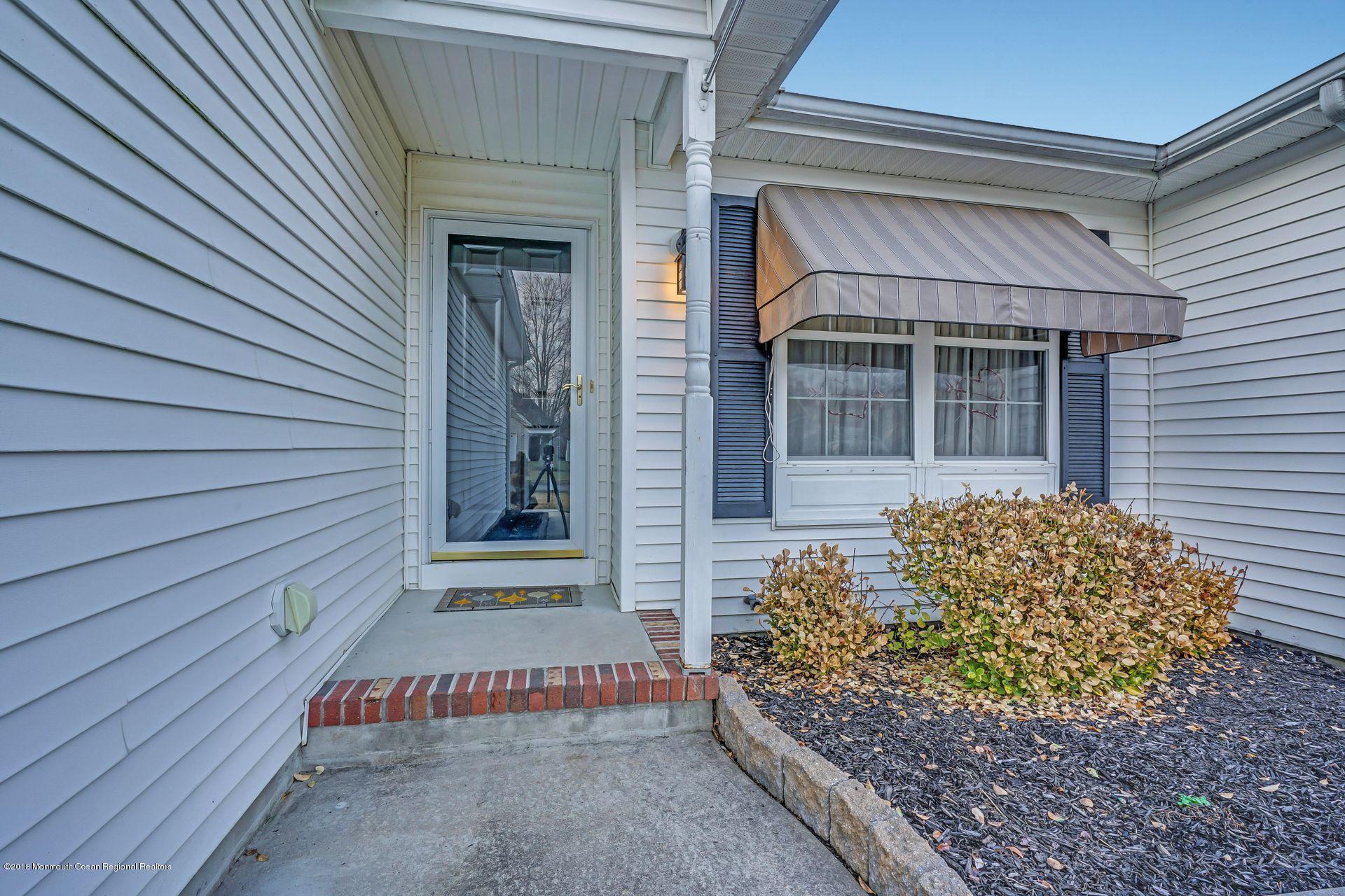 136 Cruise Road Manahawkin, NJ 08050 - Photo 3 of 34 a front view of a house with a garage