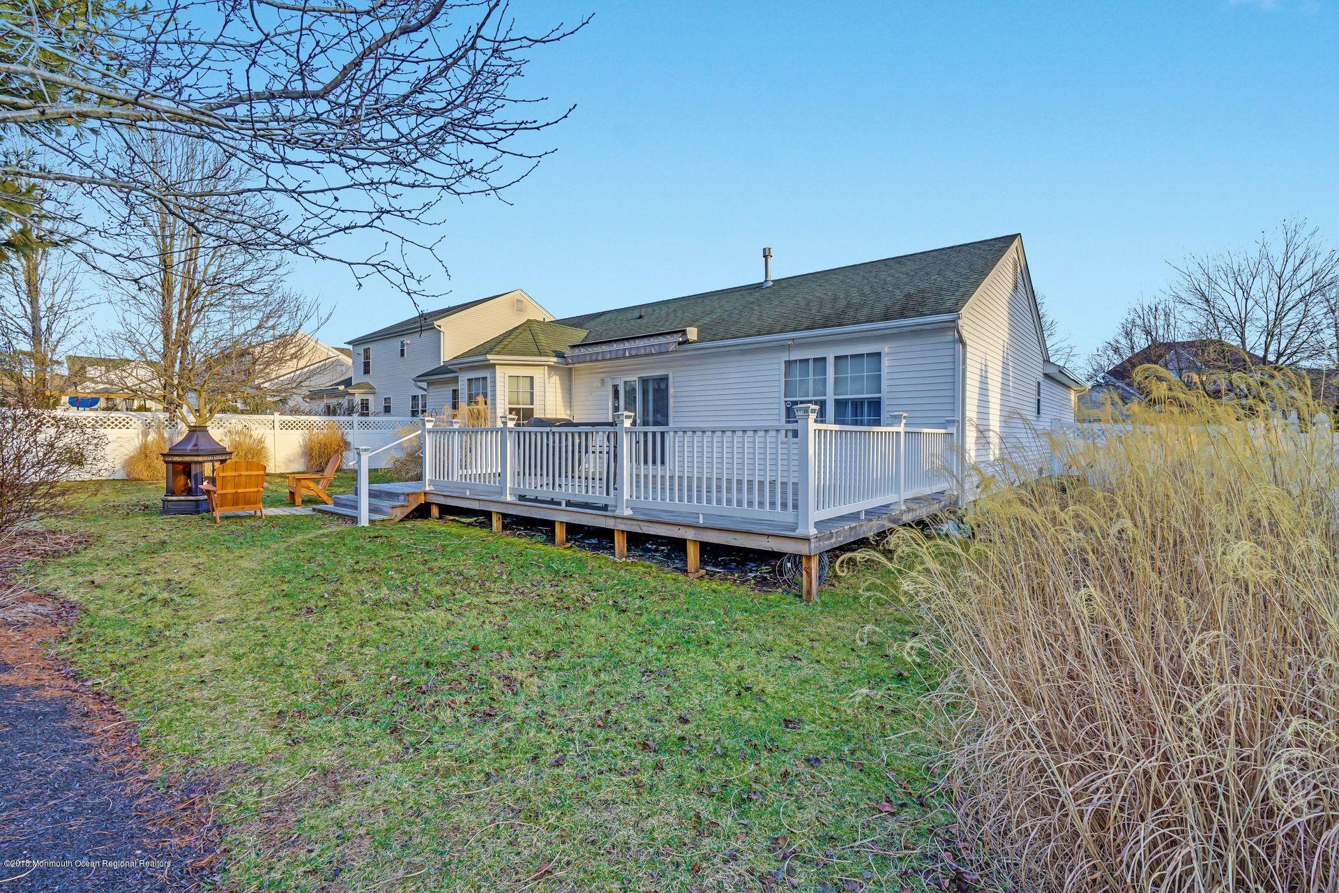 136 Cruise Road Manahawkin, NJ 08050 - Photo 33 of 34 a view of a house with a yard and sitting area
