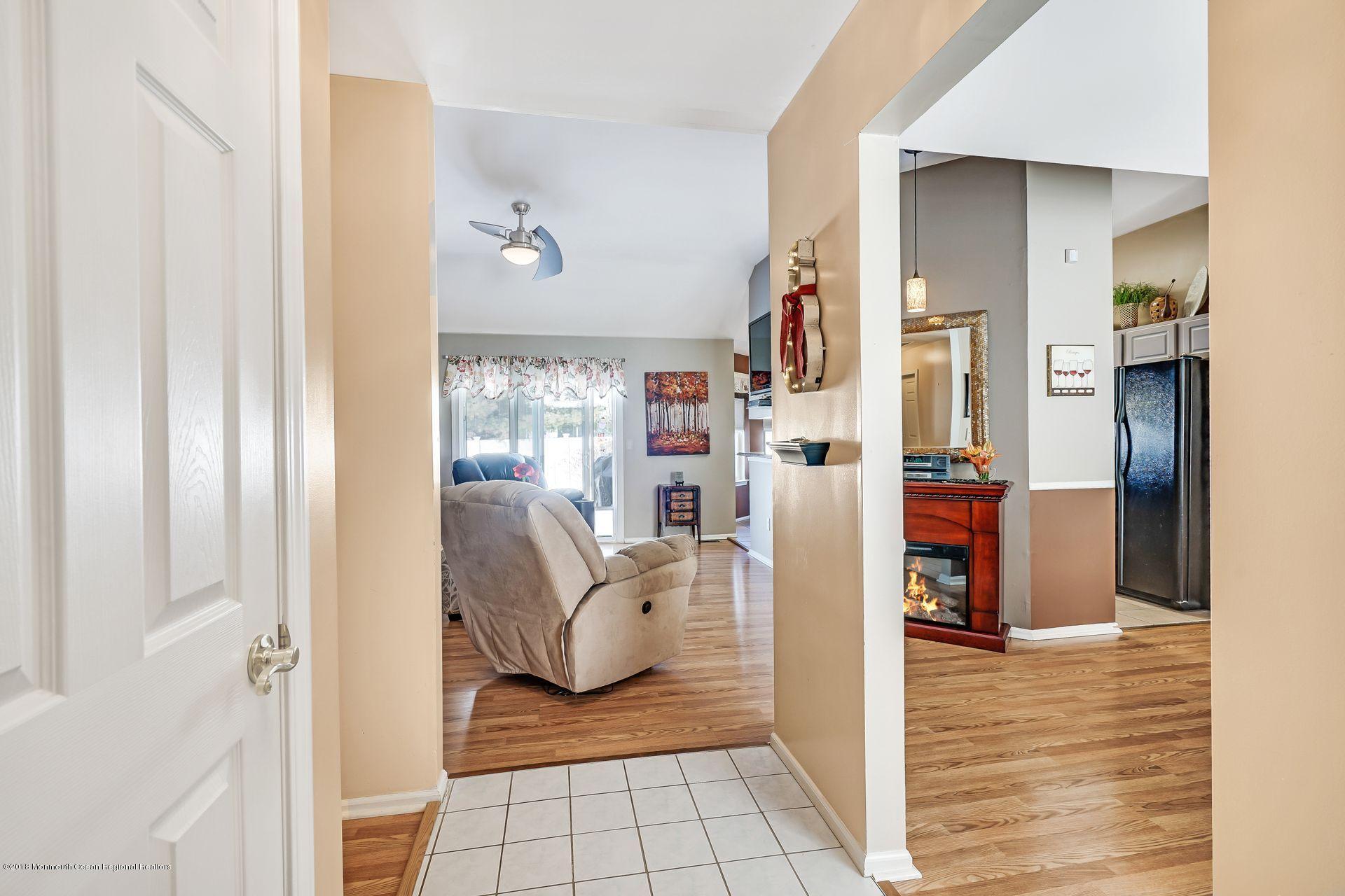 136 Cruise Road Manahawkin, NJ 08050 - Photo 4 of 34 a living room with furniture and a rug