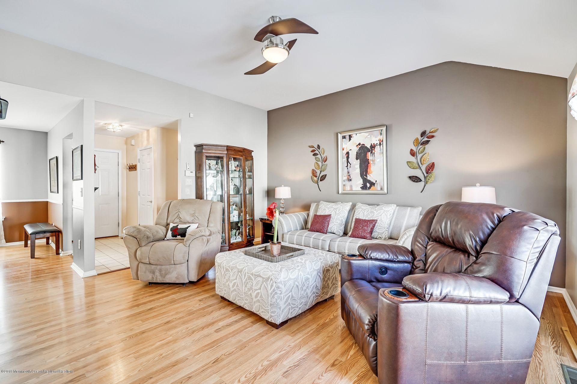 136 Cruise Road Manahawkin, NJ 08050 - Photo 6 of 34 a living room with furniture and wooden floor