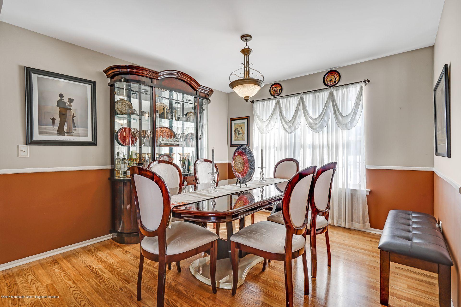 136 Cruise Road Manahawkin, NJ 08050 - Photo 9 of 34 a view of a dining room with furniture window and wooden floor