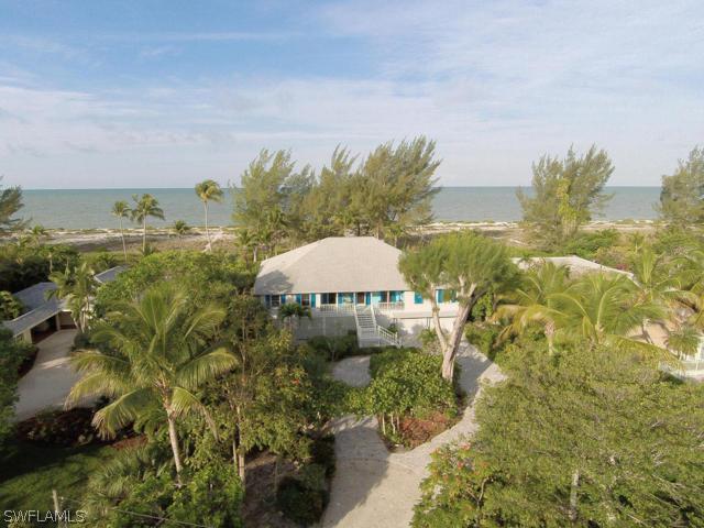 a view of a lake in front of middle of house