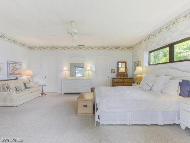 4627 Rue Belle Mer Sanibel, FL 33957 - Photo 12 of 25 a bedroom with a bed and window