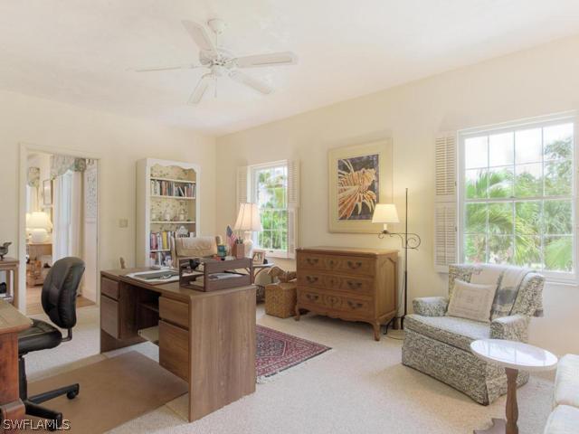4627 Rue Belle Mer Sanibel, FL 33957 - Photo 14 of 25 a living room with furniture and a large window