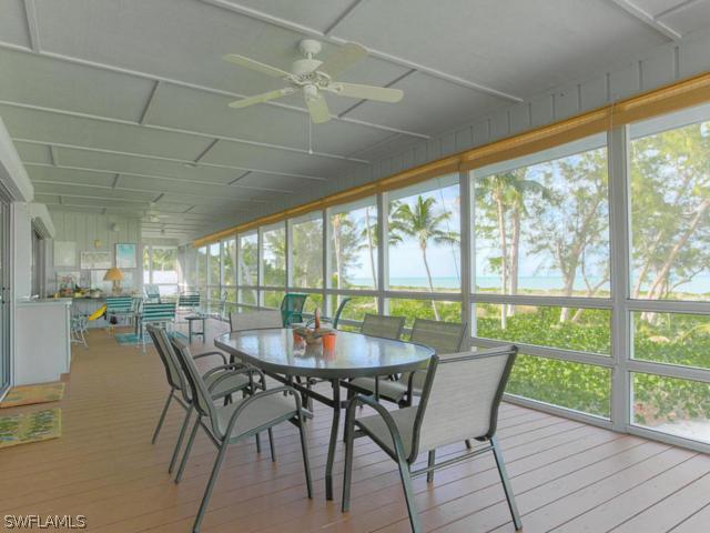 4627 Rue Belle Mer Sanibel, FL 33957 - Photo 15 of 25 a dining room with furniture window and outside view