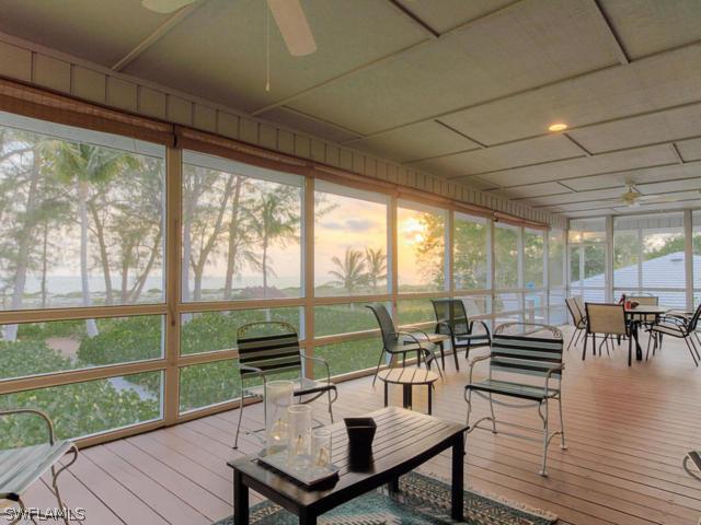 4627 Rue Belle Mer Sanibel, FL 33957 - Photo 18 of 25 a living room with furniture and a large window