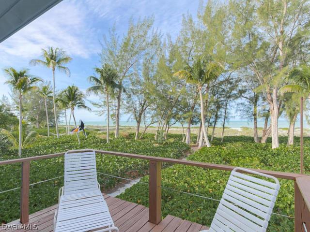 4627 Rue Belle Mer Sanibel, FL 33957 - Photo 19 of 25 a view of a deck with a garden