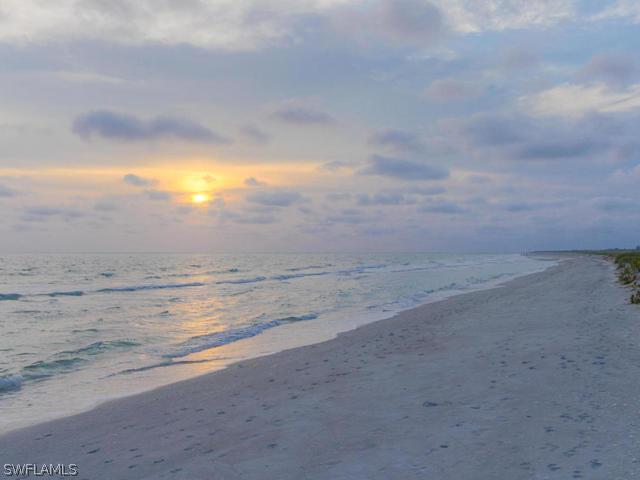 4627 Rue Belle Mer Sanibel, FL 33957 - Photo 23 of 25 a view of beach and ocean