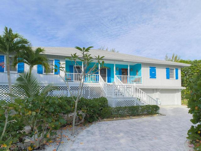 4627 Rue Belle Mer Sanibel, FL 33957 - Photo 25 of 25 front view of house with a yard