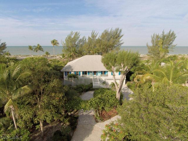 4627 Rue Belle Mer Sanibel, FL 33957 - Photo 4 of 25 a view of a garden