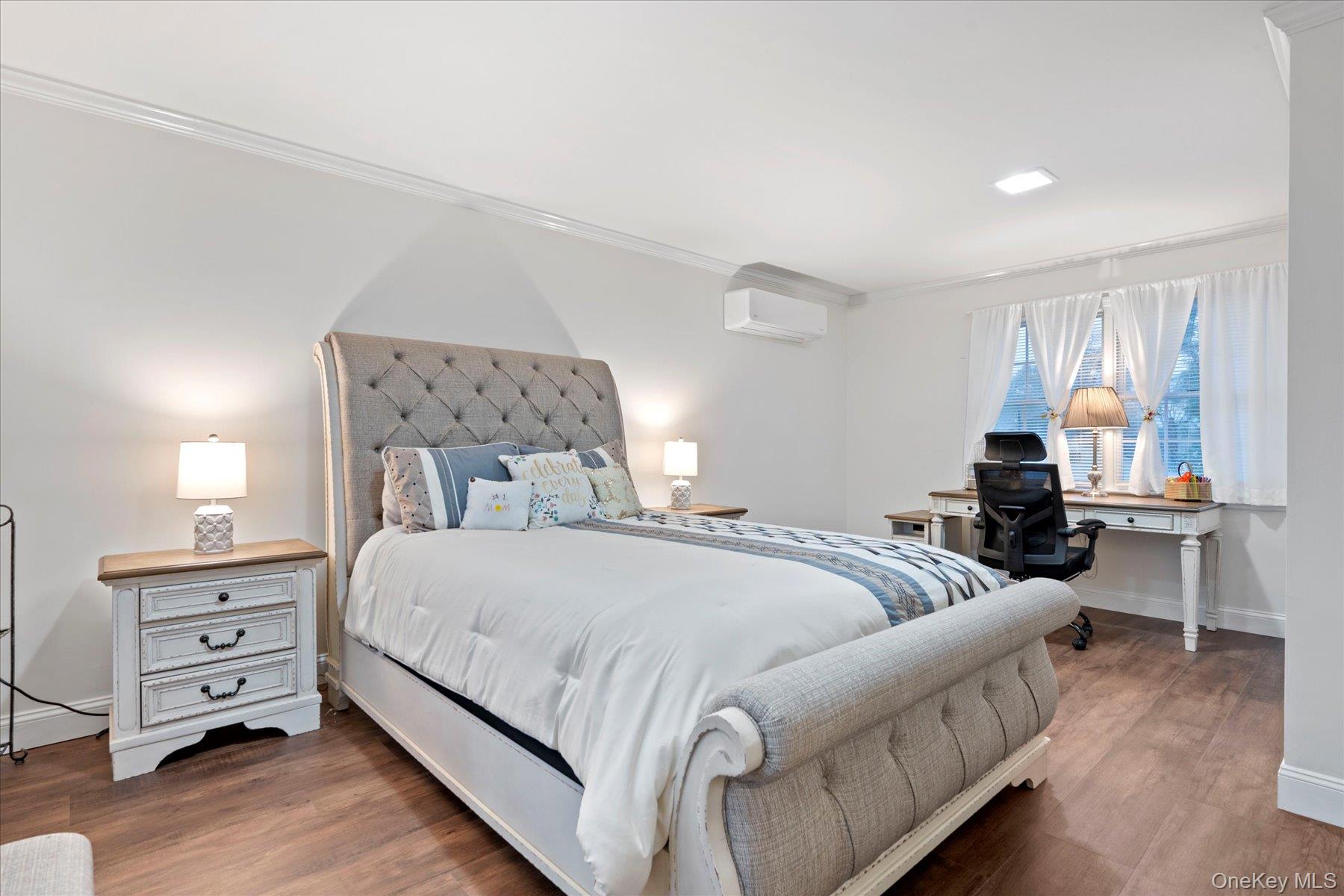 51 Marvin Street Patchogue, NY 11772 - Photo 16 of 25 a bedroom with a bed and wooden floor